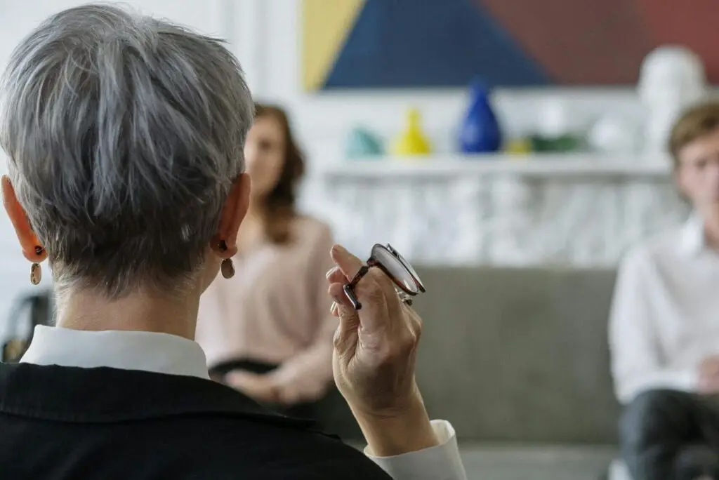 Therapist speaking to christian couples counseling clients.